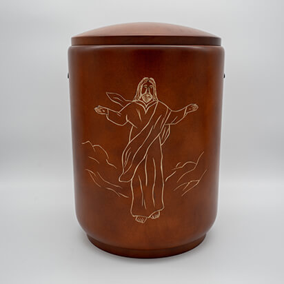 Gedrechselte Holzurne in braun mit handgeschnitzem Jesus Motiv